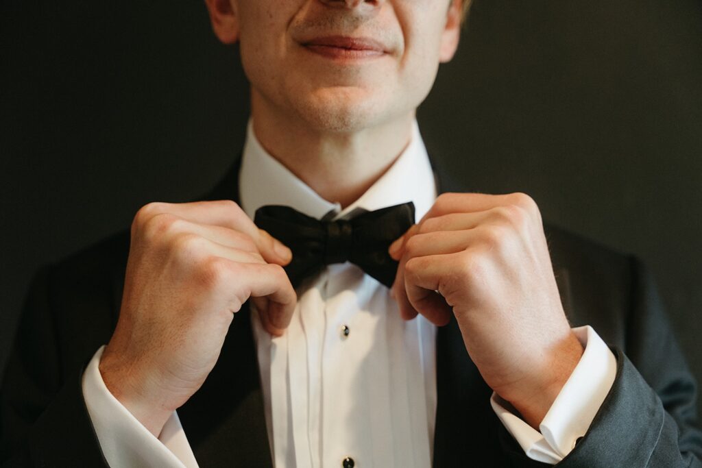 Groom adjusting bowtie at Maleny Country Estate wedding, Sunshine Coast Hinterland