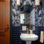 Boutique bathroom with navy feature tiles and floral wallpaper at Maleny Country Estate House, Sunshine Coast Hinterland