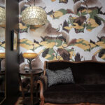 Boutique lounge with crane wallpaper and velvet sofa at Maleny Country Estate House, Sunshine Coast Hinterland