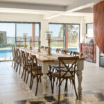 rge dining table with pool and hinterland views at Maleny Country Estate House, Sunshine Coast Hinterland