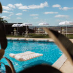 Wedding pool area with white umbrellas and Sunshine Coast Hinterland views at Maleny Country Estate